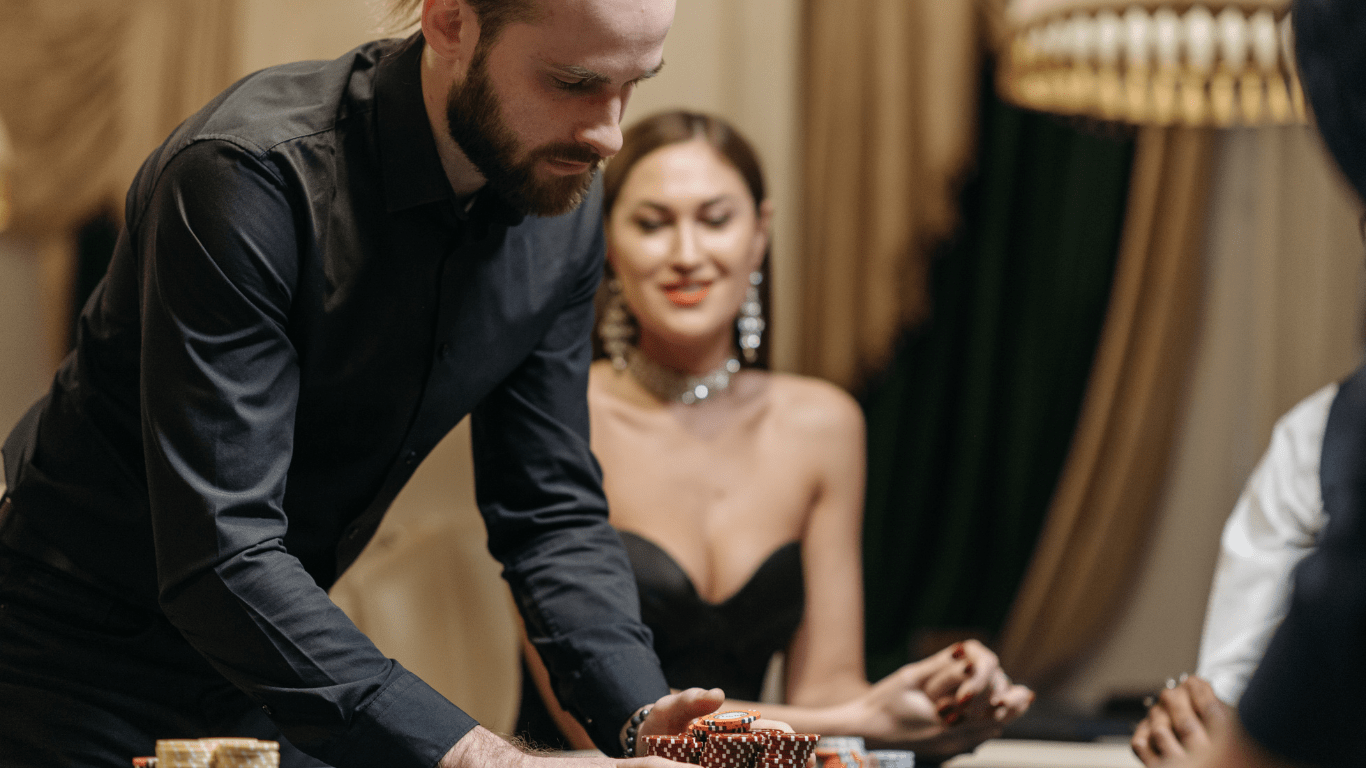 a group of people playing roulette at a casino table