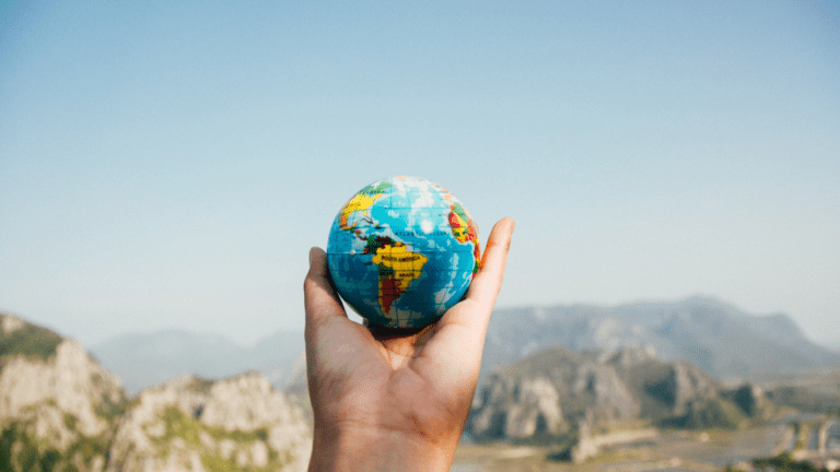 a person holding a globe