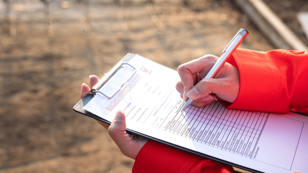 a person writing on a piece of paper